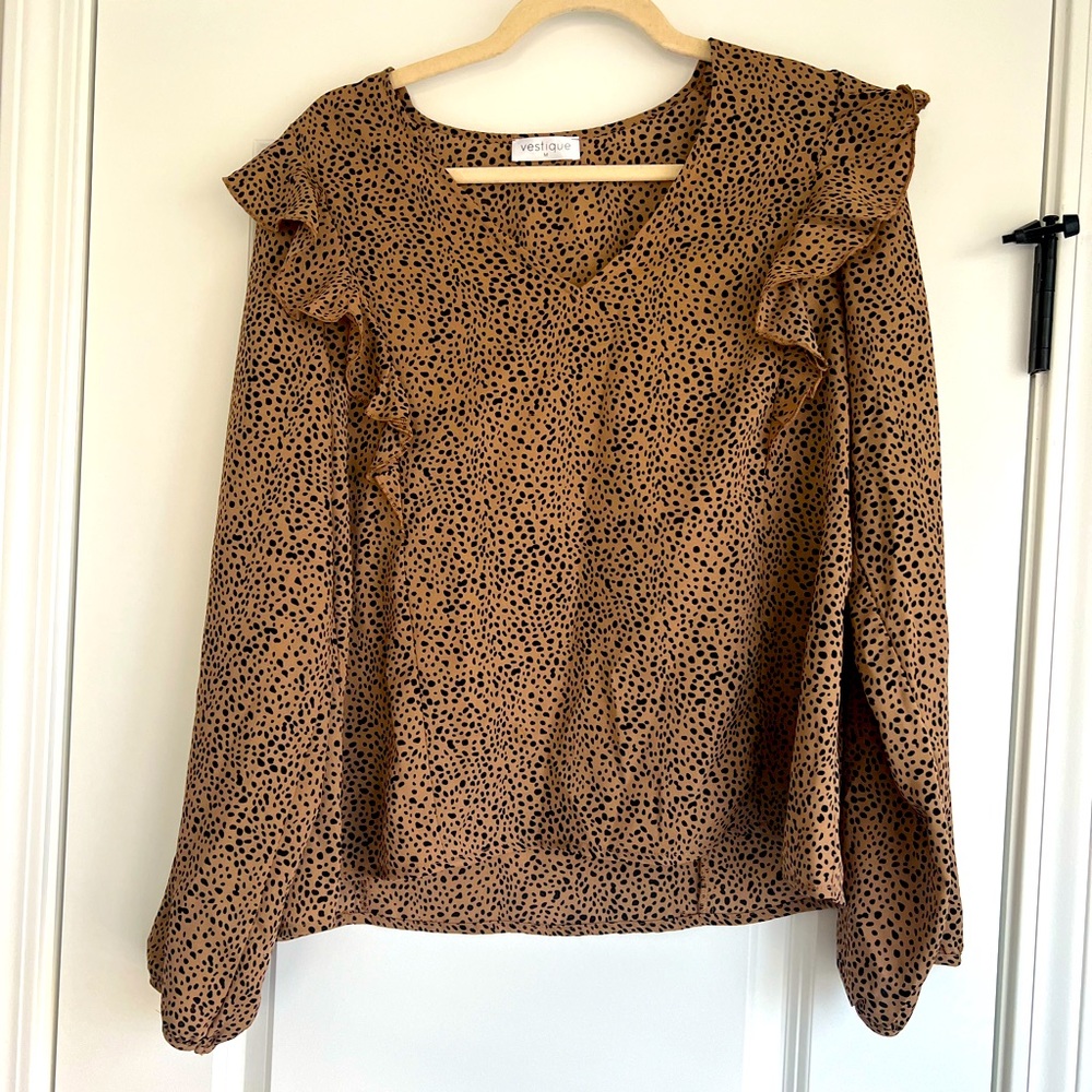 Size medium animal print top by Vestique.